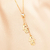 Colar gravatinha com ponto de luz e 2 meninas banhado em ouro 18 k - comprar online