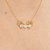 Colar com 2 meninas cravejado com zircônias banhado em ouro 18k - comprar online