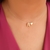 Colar fio de nylon e letra R banhado em ouro 18k