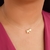 Colar fio de nylon e letra M banhado em ouro 18k