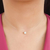 Colar ponto de luz no fio de nylon banhado em ouro 18k