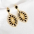 Brinco luxuoso com pedras pretas banhado em ouro 18k na internet