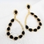 Brinco grande com gotas pretas banhado em ouro 18k na internet