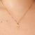 Colar com pingente de menino e coração com símbolo do autismo banhado em ouro 18k