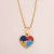 Colar com pingente de coração com símbolo do autismo banhado em ouro 18k na internet