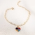 Pulseira com pingente de coração com símbolo do autismo banhado em ouro 18k na internet