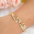 Pulseira com rosas e pedrinhas cristais banhada em ouro 18k