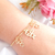 Pulseira 2 meninas e 1 menino banhada em ouro 18k