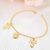 Pulseira com menino e menina banhada em ouro 18k - comprar online