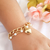 Pulseira com corrente pérolas e coração banhada em ouro 18k