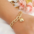 Pulseira com elos e pingente de coração banhada em ouro 18k