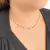 Colar com pedrinhas pretas banhado em ouro 18k