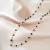 Colar com pedrinhas pretas banhado em ouro 18k - comprar online