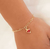 Conjunto infantil com brinco e pulseira coração rosa banhado em ouro 18k na internet