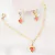 Conjunto infantil com brinco e pulseira coração rosa banhado em ouro 18k