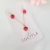 Conjunto de brinco e colar circulares com pedras rosas banhado em ouro 18k