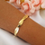 Pulseira fitas entrelaçadas banhado em ouro 18k