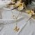 Colar gravatinha com coração e letra M banhado em ouro 18k - comprar online