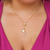 Colar gravatinha com ponto de luz e letra C banhado em ouro 18 k
