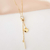 Colar gravatinha com ponto de luz e letra i banhado em ouro 18 k - comprar online