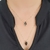 Colar duplo com pedras pretas banhado em ouro 18k