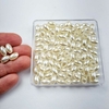 Miçanga arroz liso com furo bege 10x6mm - 10 gramas