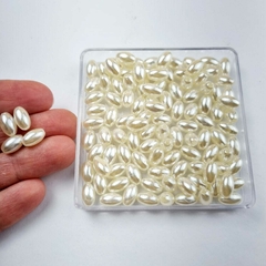 Miçanga arroz liso com furo bege 10x6mm - 10 gramas