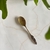 CUCHARA PLUMA BRONCE