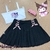 Saia colegial preta com fitas e renda na barra - Doll me up
