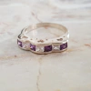 Anillo en Plata con Cúbic baguette blanco y violeta