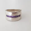 Anillo en Plata con hilera de Cúbic violeta