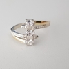 Anillo en Plata y Oro con 3 cúbic blancos
