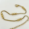 Pulsera con bolitas en acero baño Oro, 18+ 5 cm.