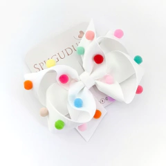 Laço Boutique Origens com pompons (Unidade) na internet