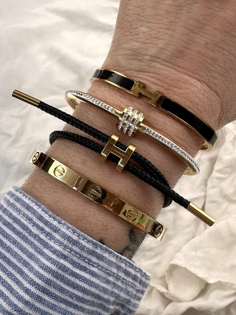 Pulsera H cordón acero con baño oro 18k