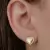 Brinco delicado de coração liso com moldura cravejada de micro zircônias cristal Banhado em Ouro 18k