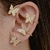 Brinco Ear cuff de encaixe com borboletas cravejadas com micro zircônias cor cristal Banhado em ouro 18k