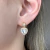 Brinco Zircônia Redonda com Pingente Coração Cravejado Banhado em Ouro 18k - comprar online