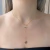 Colar Gravatinha Rosa Lisa Banhado em Ouro 18k - comprar online