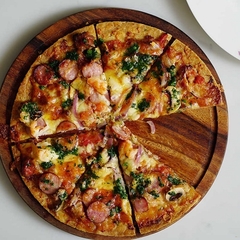 Plato de madera pizzero x 35 cm - comprar online