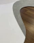 Sala de estar com tapete orgânico em tecido Bouclé nas cores verde, off-white e natural, Tapetes São José