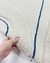 Tapete de nylon com design em duas alturas, nas cores off-white e azul petróleo, com padrão de linhas e formas geométricas, São José