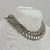 Imagem do colar choker cocar metalizado estúdio marcha