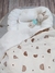 Imagen de NIDITO DE CONTENCIÓN BLANCO A ESTRELLAS + MANTITA DE CORDERITO