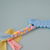 Juguete Para Perro Mordillo Modelo Hueso con Soga Pastel - tienda online