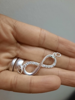 Dije Infinito con piedras en internet