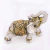Elefante ouro velho com strass laranja na internet