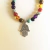Pulseira dos 7 Chakras em Pedra com Pingente de Mão Hansá - comprar online