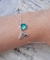 Patuá Cauda Sereia e Pedra Verde Furta Cor 8mm - comprar online