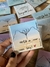 Ímãs com tag personalizadas no saquinho organza na internet